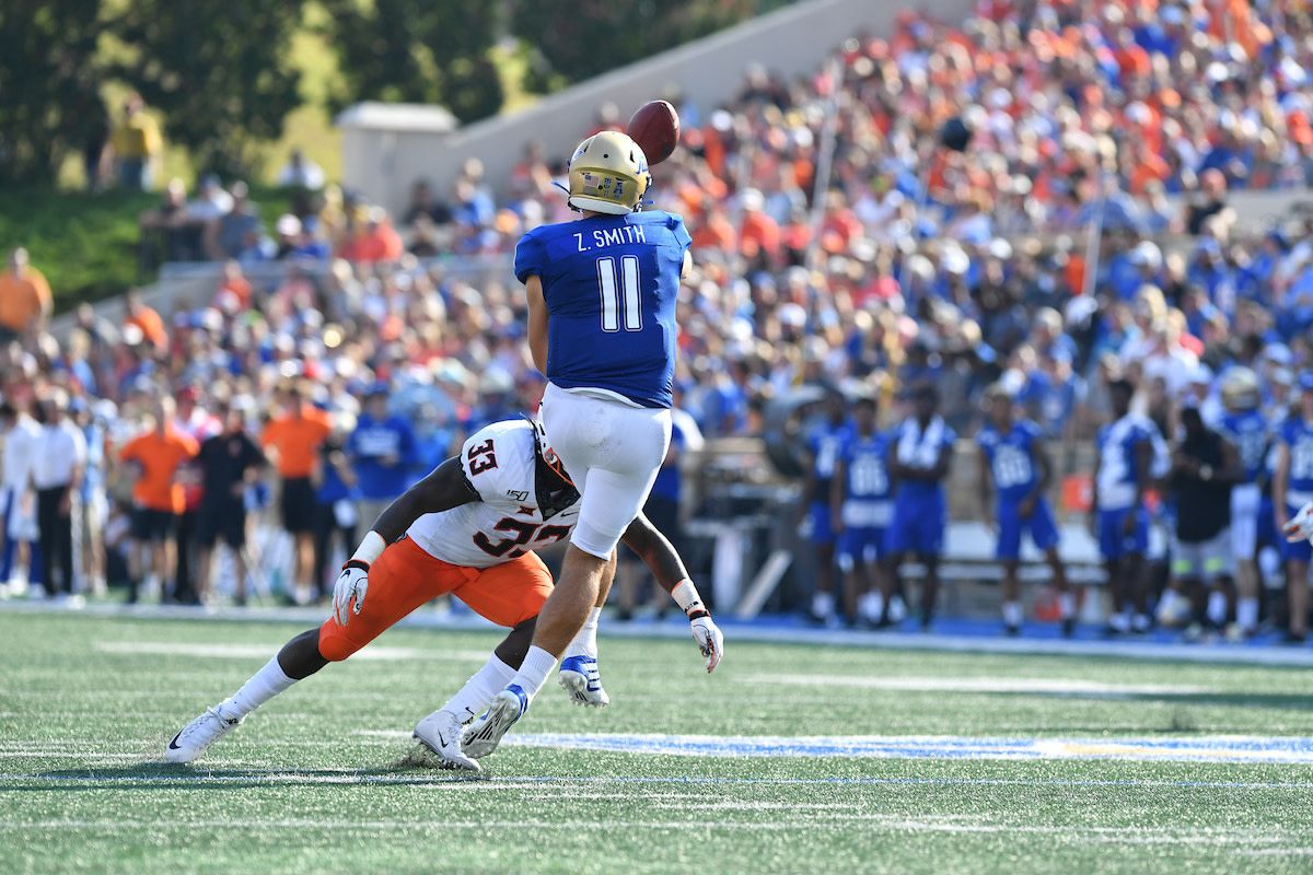 Last year against Oklahoma State, Smith was hounded by the Cowboys with linebacker (33) Kevin Henry on the pass rush. Smith as sacked three times.