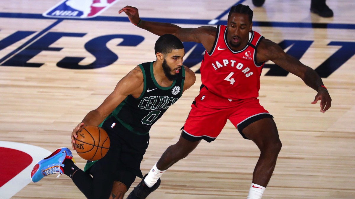 Boston Celtics forward Jayson Tatum (0) dribbles the ball against Toronto Raptors forward Rondae Hollis-Jefferson (4) during the second half of game five of the second round in the 2020 NBA Playoffs