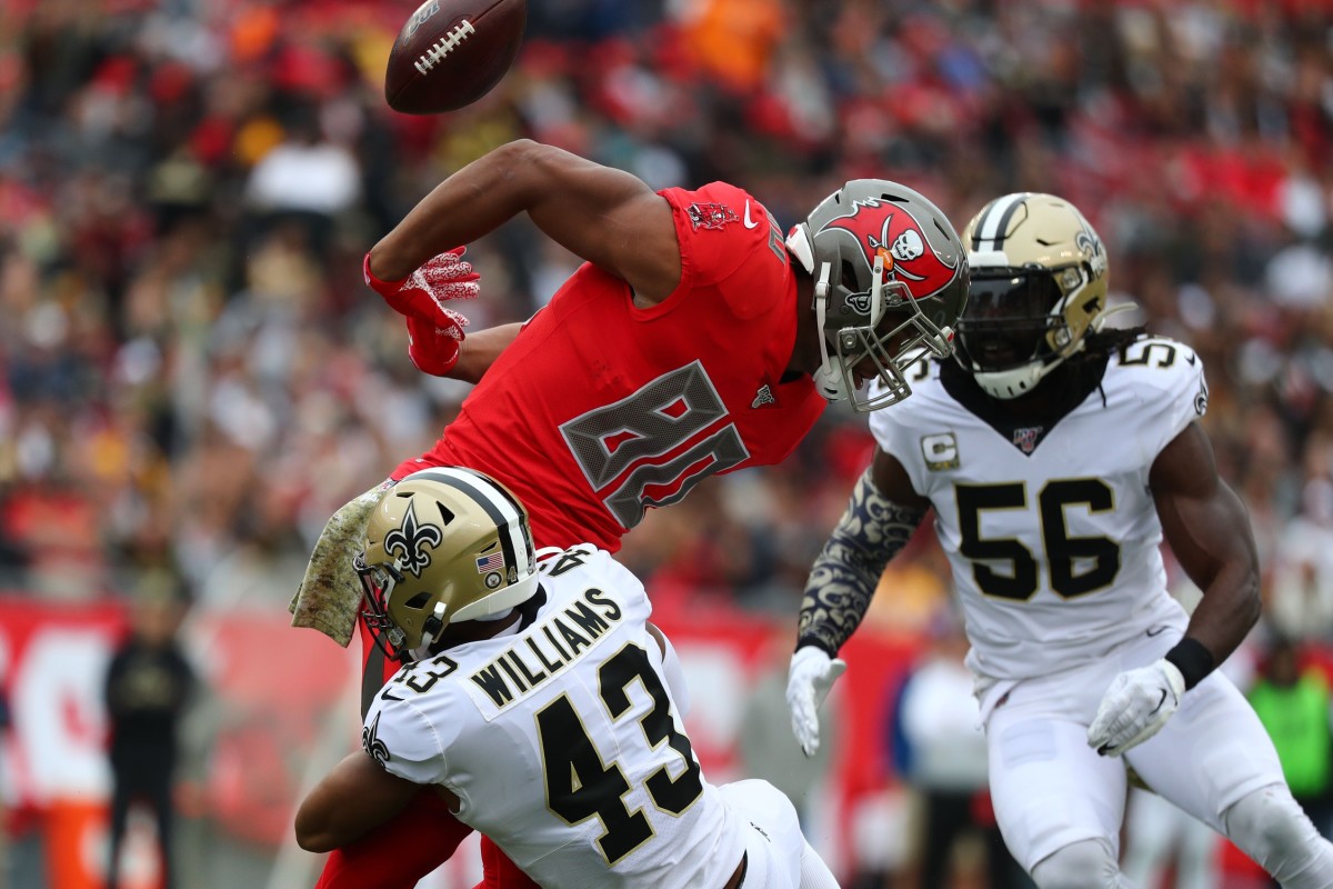 Nov 17, 2019; Tampa, FL, USA; Tampa Bay Buccaneers tight end O.J. Howard (80) juggles a pass against New Orleans Saints free safety Marcus Williams (43) as New Orleans outside linebacker Demario Davis (56) intercepts the ball during the first half at Raymond James Stadium. Mandatory Credit: Kim Klement-USA TODAY