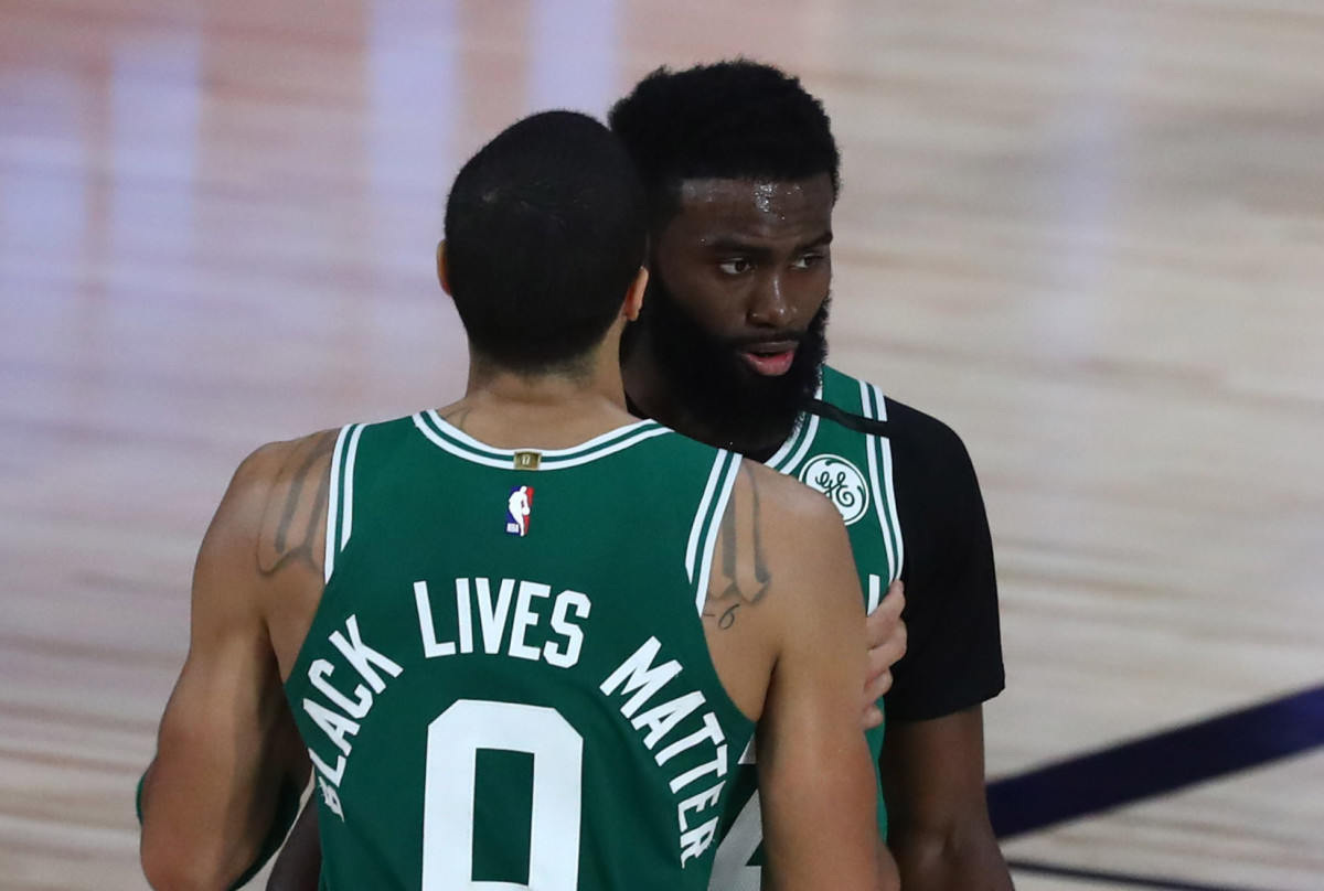 Boston Celtics forward Jayson Tatum (0) and guard Jaylen Brown (7) react at the end of the first overtime period in game six against the Toronto Raptors in the second round of the 2020 NBA Playoffs