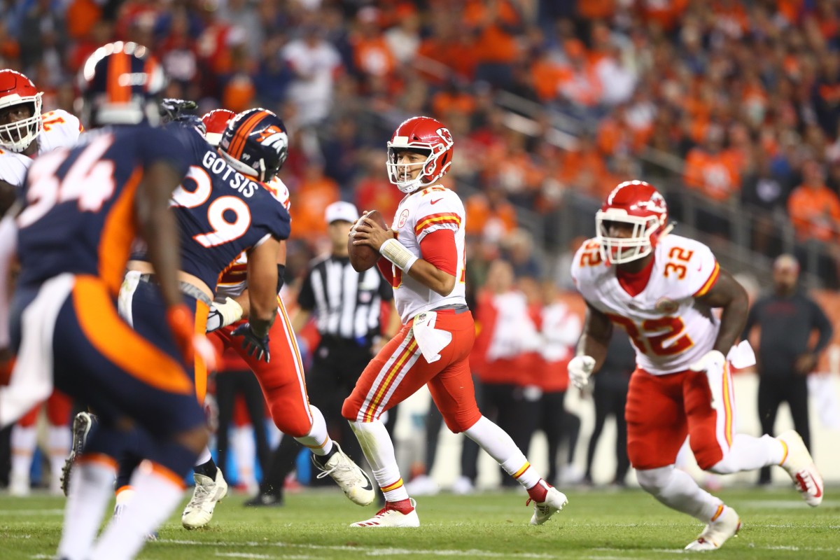 Oct 1, 2018; Denver, CO, USA; Kansas City Chiefs quarterback Patrick Mahomes (15) against the Denver Broncos at Broncos Stadium at Mile High. Mandatory Credit: Mark J. Rebilas-USA TODAY
