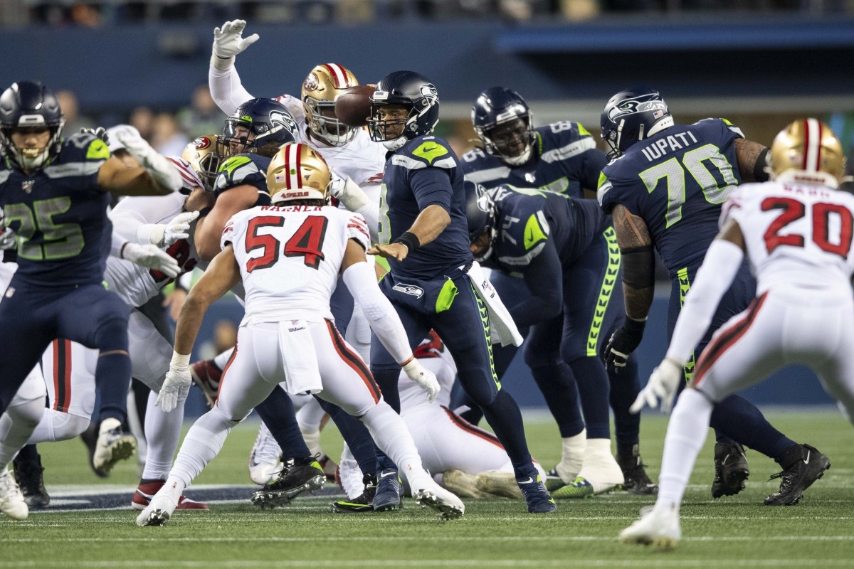 Dec 29, 2019; Seattle, Washington, USA; Seattle Seahawks quarterback Russell Wilson (3) passes the ball against the San Francisco 49ers during the first half at CenturyLink Field. San Francisco defeated Seattle 26-21. Mandatory Credit: Steven Bisig-USA TODAY Sports