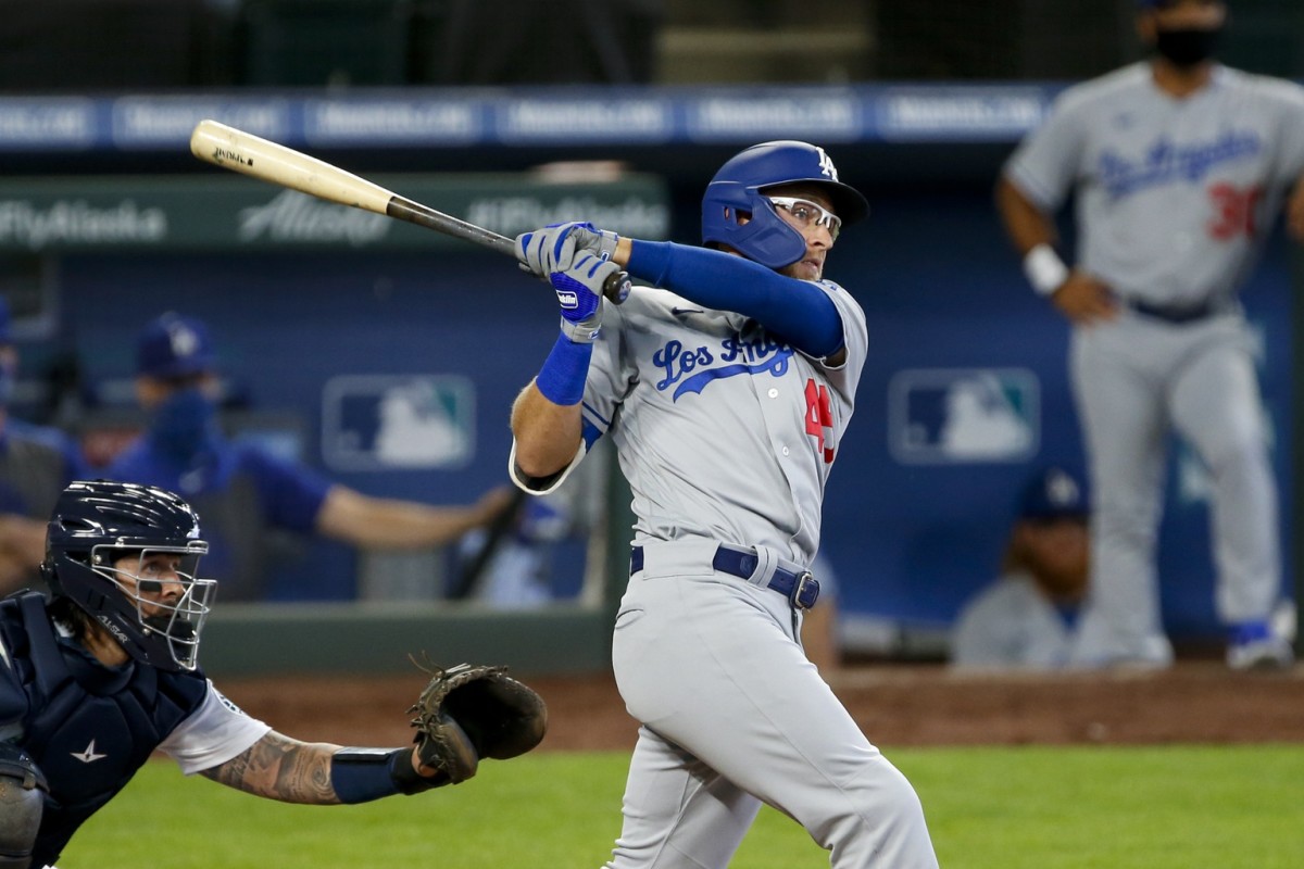 Aug 20, 2020; Seattle, Washington, USA; Los Angeles Dodgers designated hitter Matt Beaty (45) hits an RBI-double against the Seattle Mariners during the third inning at T-Mobile Park. Mandatory Credit: Joe Nicholson-USA TODAY Sports