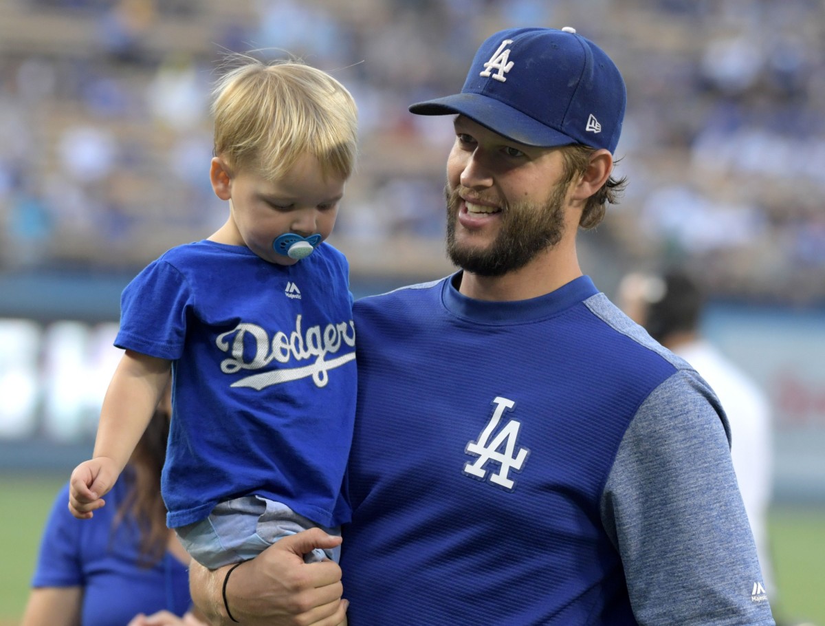 Aug 20, 2018; Los Angeles, CA, USA; Los Angeles Dodgers starting pitcher Clayton Kershaw holds his son Charley Kershaw before the game against the St. Louis Cardinals at Dodger Stadium.The Cardinals defeated the Dodgers 5-3. Mandatory Credit: Kirby Lee-USA TODAY Sports