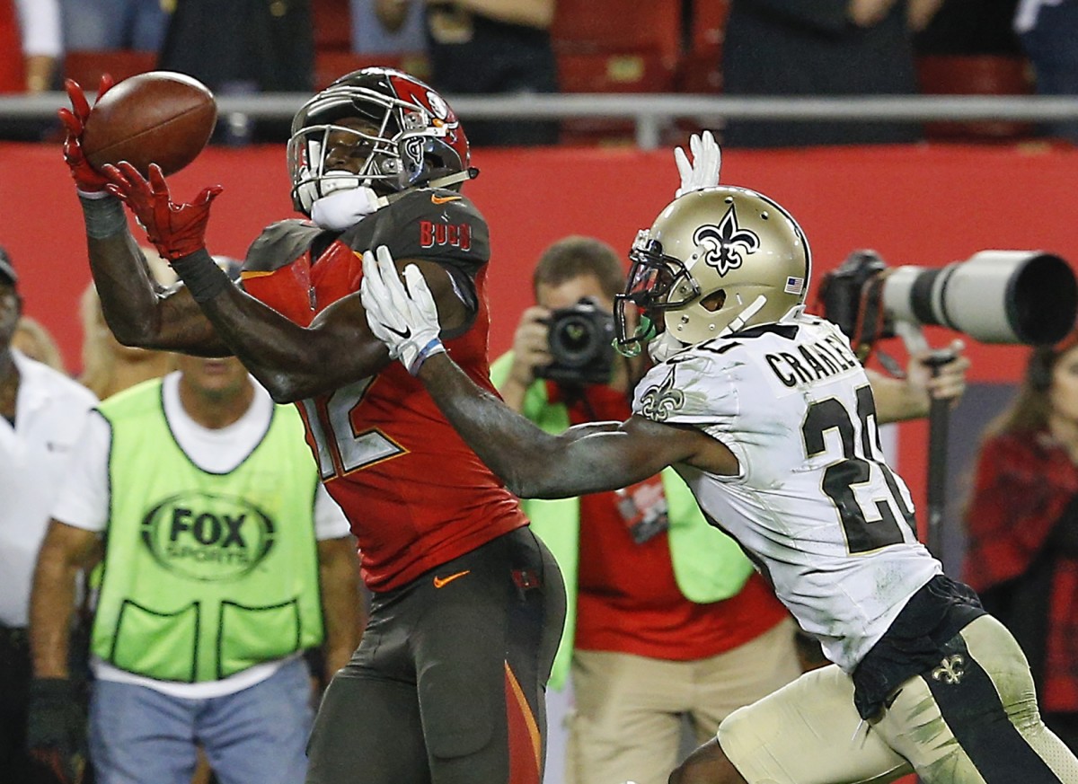 Dec 31, 2017; Tampa, FL, USA; Tampa Bay Buccaneers wide receiver Chris Godwin (12) catches the go ahead touchdown pass beyond New Orleans Saints cornerback Ken Crawley (20) during the second half at Raymond James Stadium. Mandatory Credit: Reinhold Matay-USA TODAY