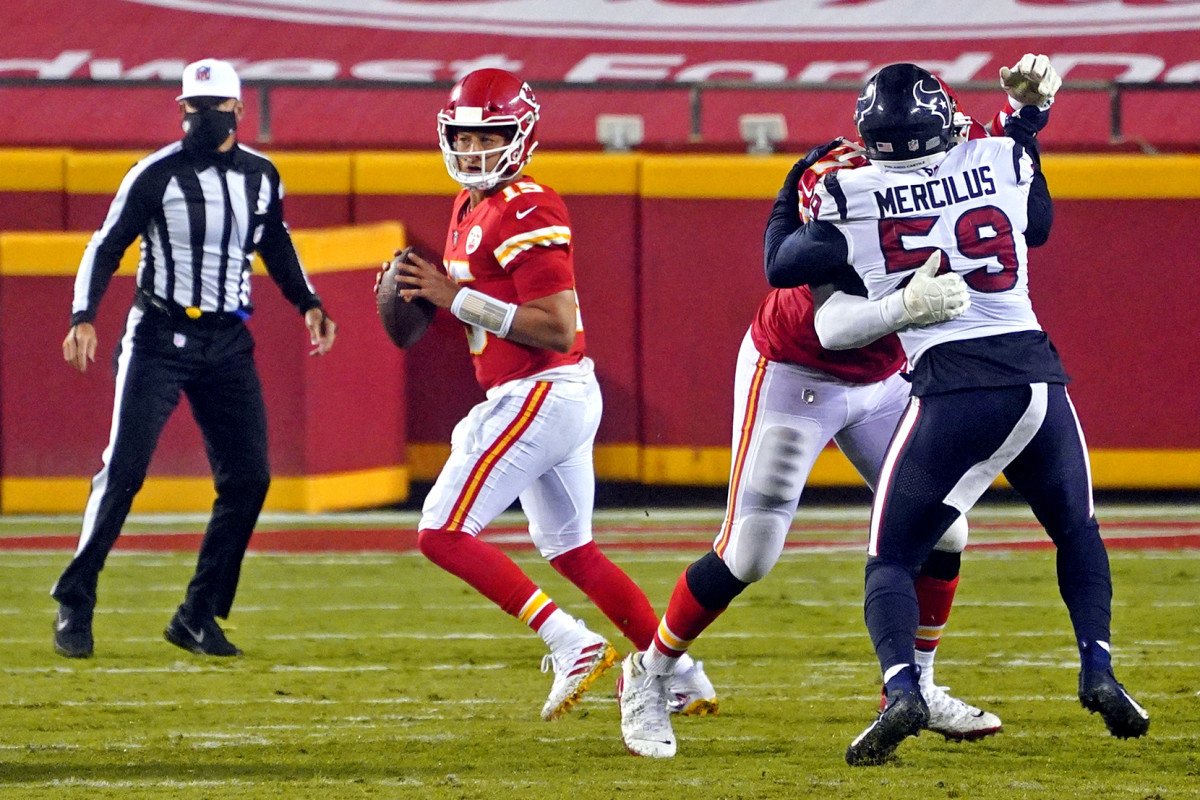 Kansas City Chiefs quarterback Patrick Mahomes (15) throws a pass against Houston Texans linebacker Whitney Mercilus (59) during the second half at Arrowhead Stadium.