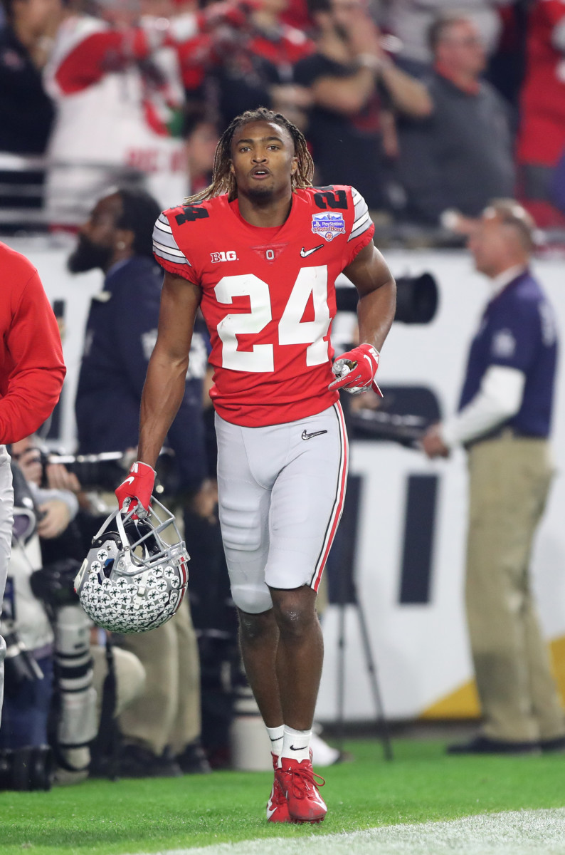Ohio State Buckeyes cornerback Shaun Wade (24) leaves the field after being ejected for targeting in the 2019 Fiesta Bowl college football playoff semifinal game against the Clemson Tigers at State Farm Stadium.