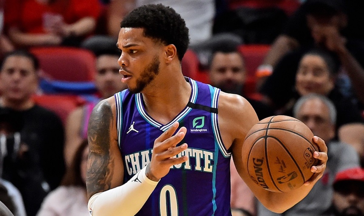 Charlotte Hornets forward Miles Bridges controls the ball during a game against the Miami Heat at American Airlines Arena.
