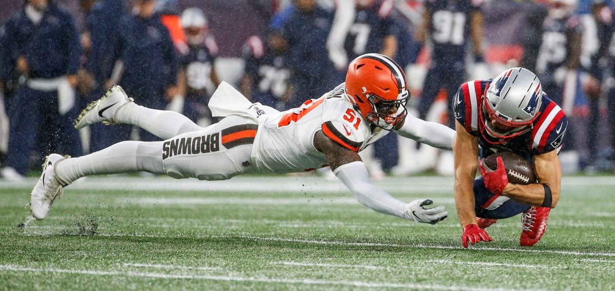 Browns linebacker Mack Wilson dives to tackle Patriots wide receiver Julian Edelman during a 2019 game. Wilson was on the verge of breaking out as the next Browns star linebacker, but he was traded to the Patriots in 2022.