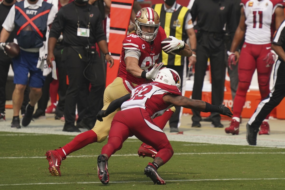 San Francisco 49ers tight end George Kittle (85) runs against Arizona Cardinals strong safety Budda Baker (32) during the first quarter at Levi's Stadium.