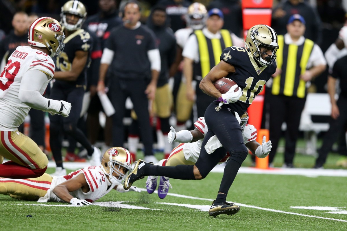 Dec 8, 2019; New Orleans, LA, USA; New Orleans Saints wide receiver Tre'Quan Smith (10) gets away from San Francisco 49ers defenders in the second half at the Mercedes-Benz Superdome. The 49ers won, 48-46. Mandatory Credit: Chuck Cook-USA TODAY