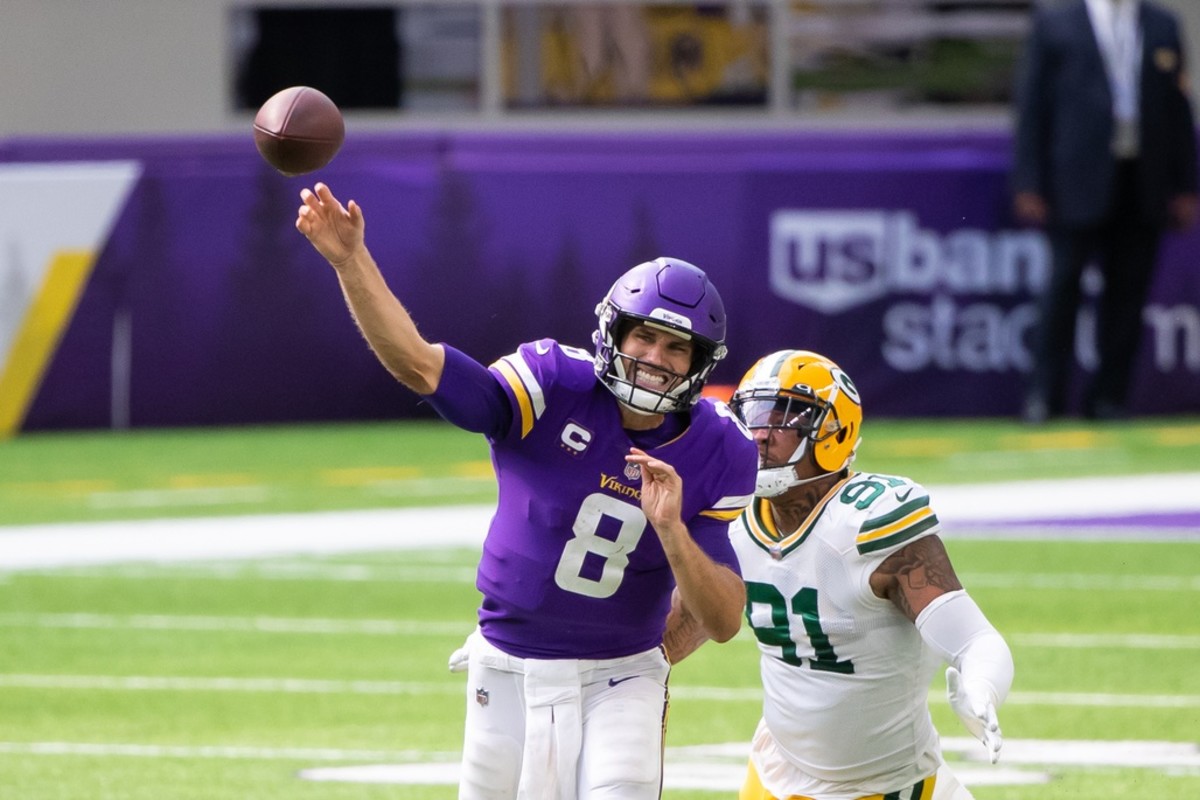 Minnesota Vikings quarterback Kirk Cousins throws a pass in Sunday's opening home loss to Green Bay.