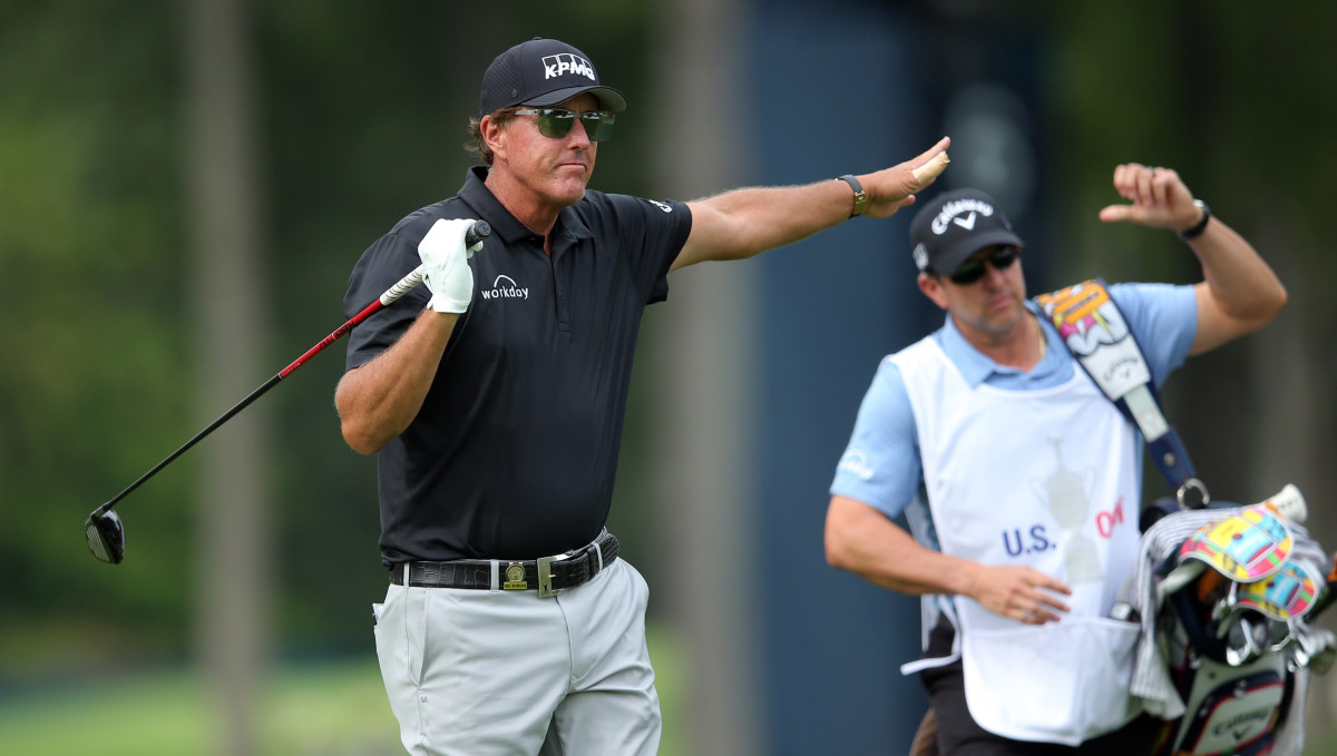 Phil Mickelson reacts to his shot from the eighth tee during the first round of the U.S. Open golf tournament at Winged Foot Golf Club