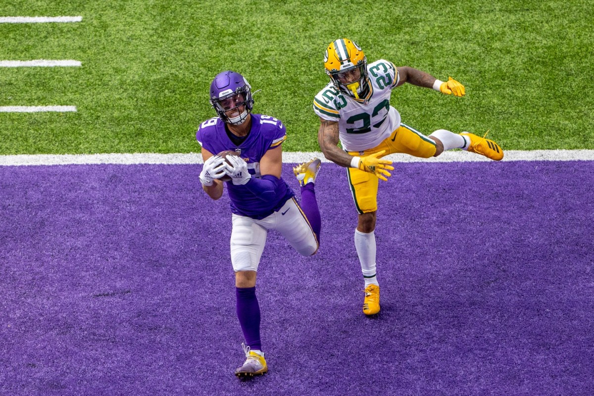 Minnesota Vikings wide receiver Adam Thielen makes one of two touchdown catches in a Week 1 home loss to Green Bay.