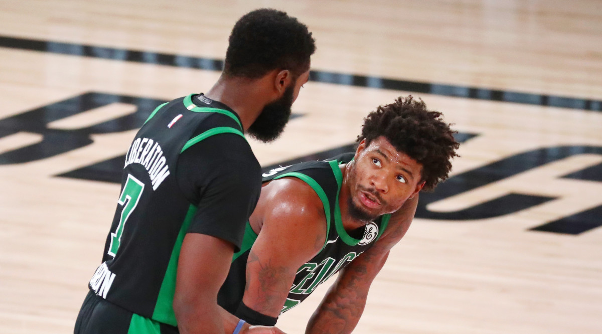 Boston Celtics guard Jaylen Brown (left) talks with guard Marcus Smart (36) during the fourth quarter of Game 2 of Eastern Conference Finals of 2020 NBA Playoffs