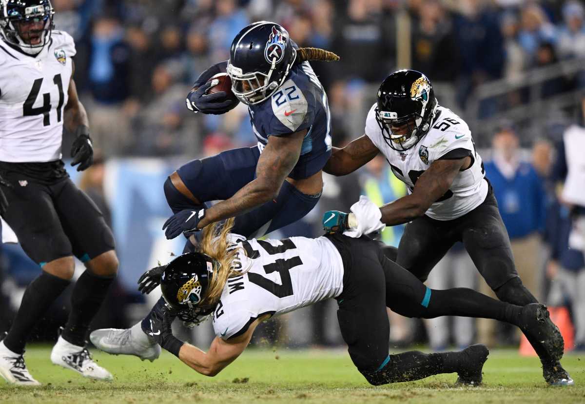 The Jaguars tackle Derrick Henry during a 2019 game. © Andrew Nelles / Tennessean.com