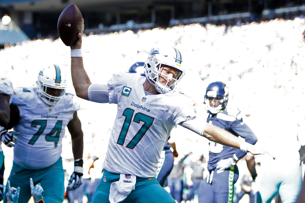 Dolphins quarterback Ryan Tannehill celebrates after rushing for a touchdown against the Seahawks in 2016. Tannehill is the franchise leader in rushing yards among quarterbacks.