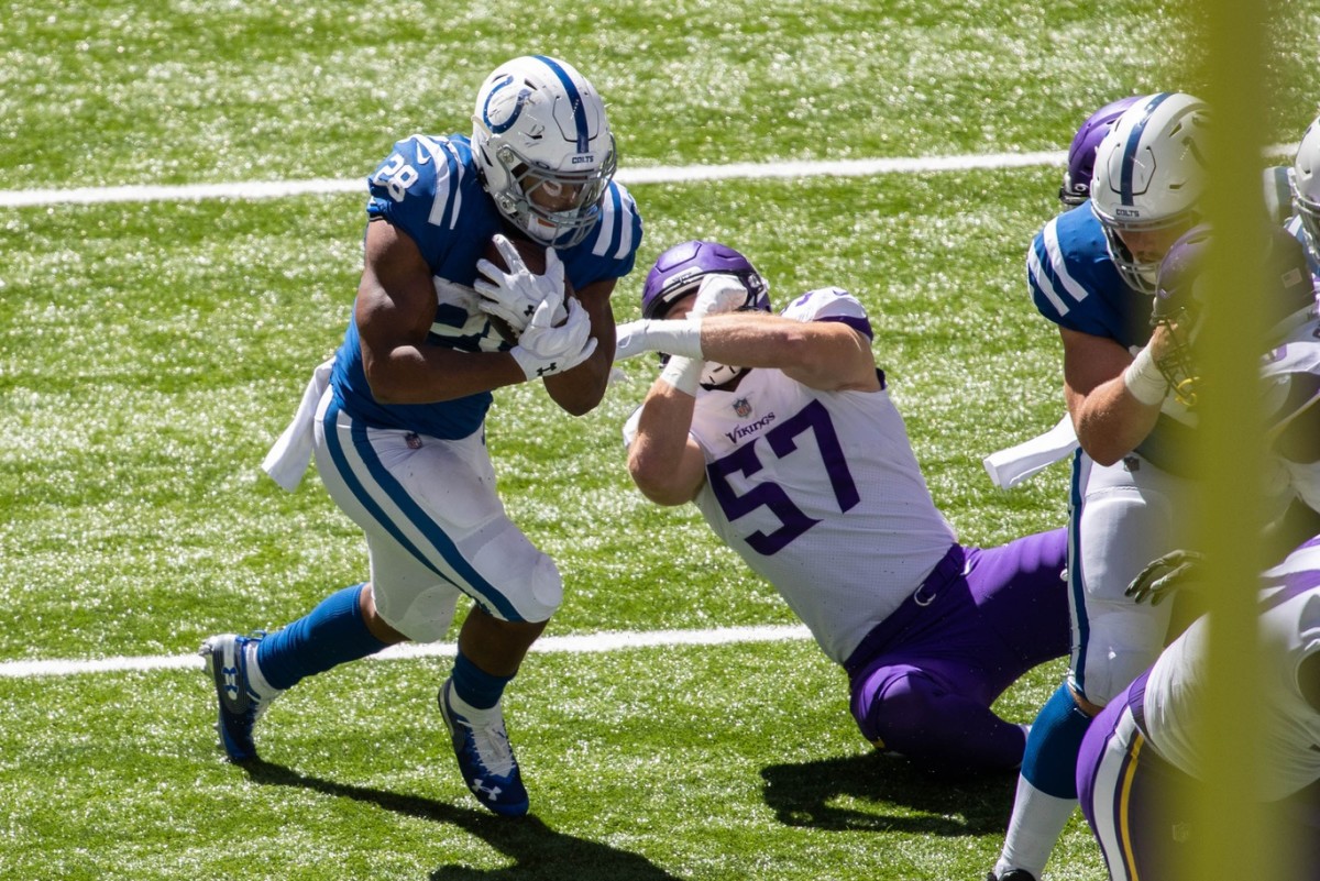 Indianapolis Colts running back Jonathan Taylor makes a tackler miss in Sunday's 28-11 home win over the Minnesota Vikings at Lucas Oil Stadium.