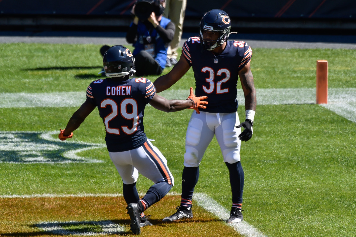 Sep 20, 2020; Chicago, Illinois, USA; Chicago Bears running back Tarik Cohen (29) and running back David Montgomery (32) celebrate a touchdown reception by Montgomery from quarterback Mitchell Trubisky (not pictured) during the first quarter against the New York Giants at Soldier Field. Mandatory Credit: