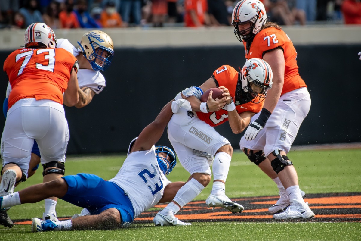 Zaven Collins (23) was a thorn in the Oklahoma State offense with six tackles, three sacks, and four tackles for loss. 