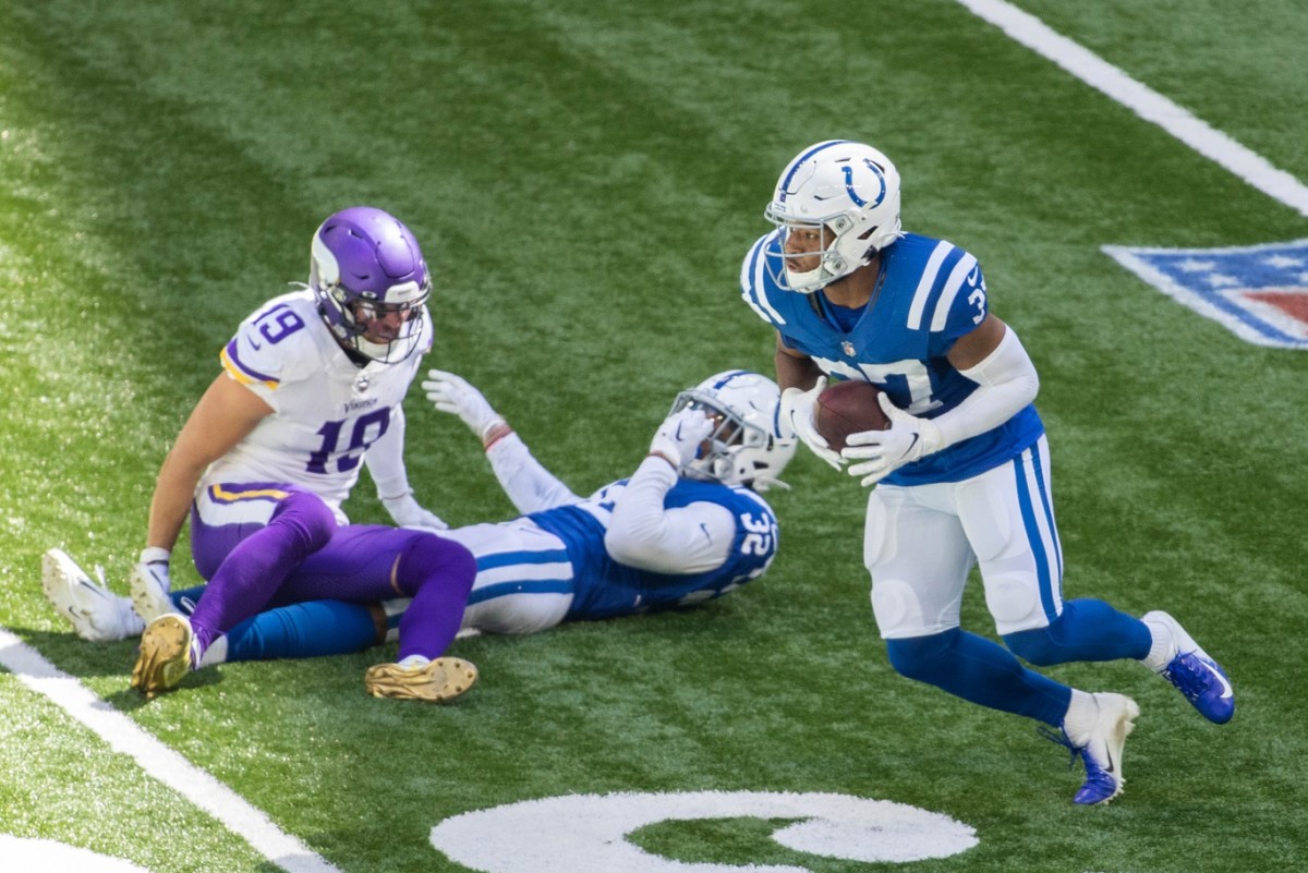 Indianapolis Colts safety Khari Willis (37) intercepts a pass tipped by rookie teammate Julian Blackmon (32) in Sunday's 28-11 home win over the Minnesota Vikings.