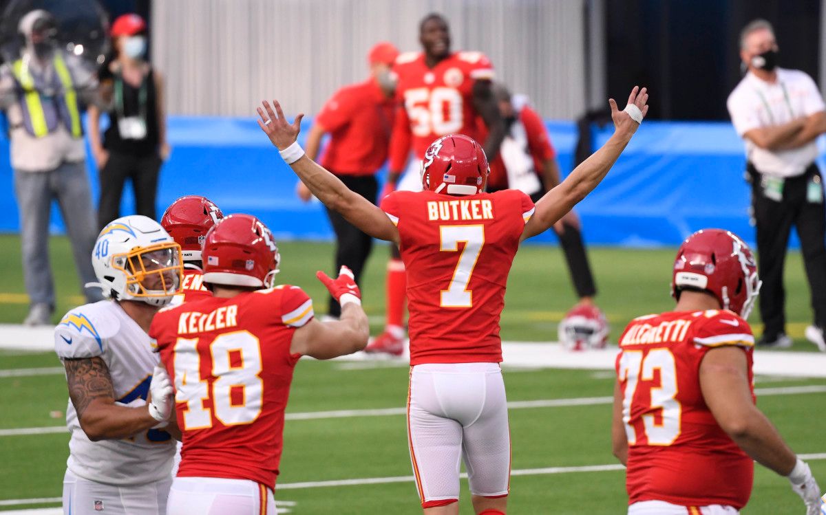Kansas City Chiefs kicker Harrison Butker (7) celebrates with teammates after kicking the game-winning 58-yard field goal against the Los Angeles Chargers during overtime at SoFi Stadium.