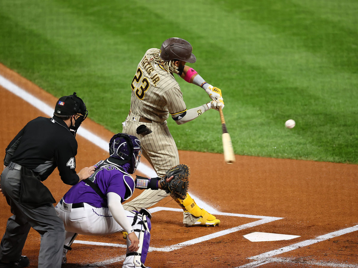 Fernando Tatis Jr. swings at a ball