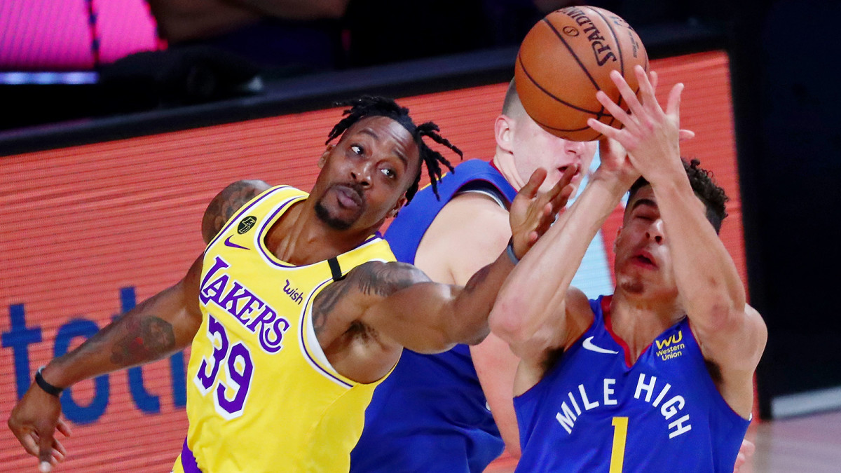 Los Angeles Lakers center Dwight Howard and Denver Nuggets forward Michael Porter Jr. reach for the ball during the Western Conference Finals