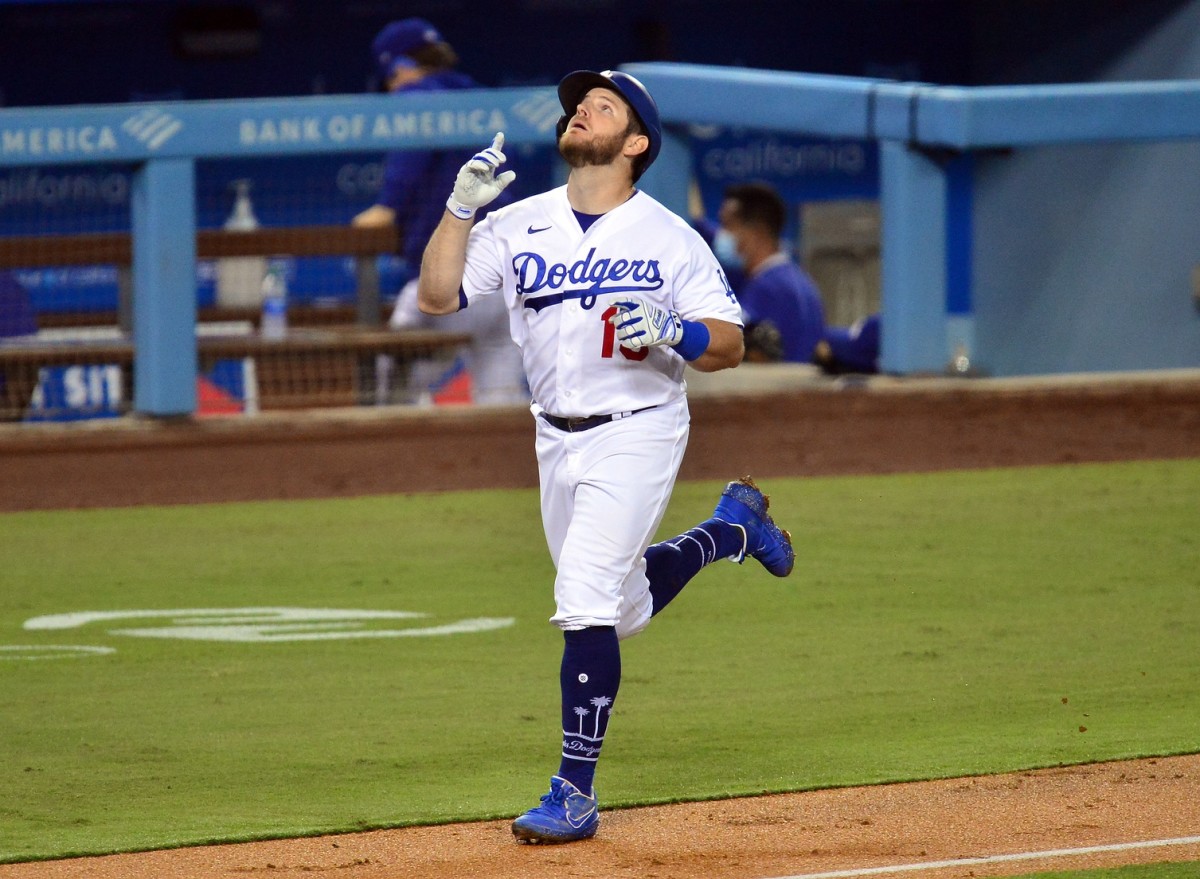 Sep 22, 2020; Los Angeles, California, USA; Los Angeles Dodgers first baseman Max Muncy (13) reacts after hitting a two run home run against the Oakland Athletics during the third inning at Dodger Stadium. Mandatory Credit: Gary A. Vasquez-USA TODAY Sports