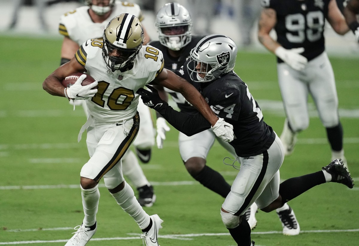 Sep 21, 2020; Paradise, Nevada, USA; New Orleans Saints wide receiver Tre'Quan Smith (10) is tackled by Las Vegas Raiders safety Johnathan Abram (24) during the first quarter of a NFL game at Allegiant Stadium. Mandatory Credit: Kirby Lee-USA TODAY