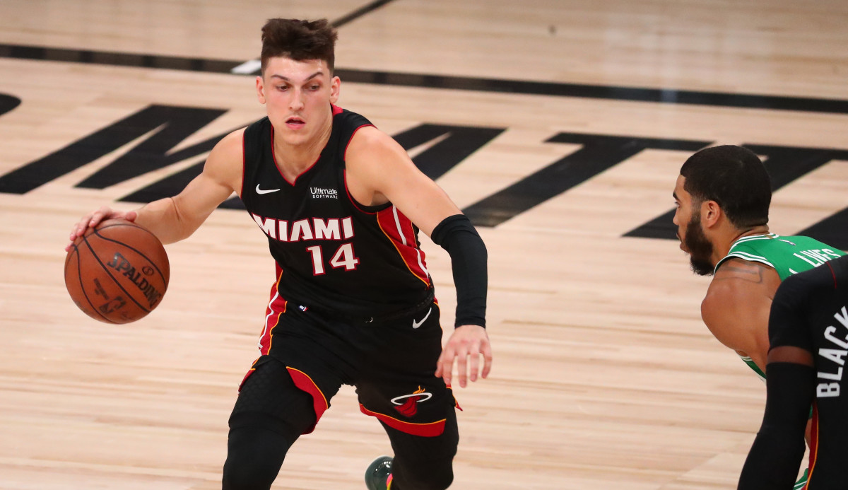 Miami Heat guard Tyler Herro (14) dribbles against Boston Celtics forward Jayson Tatum (right) during the first half of game four of the Eastern Conference Finals of the 2020 NBA Playoffs