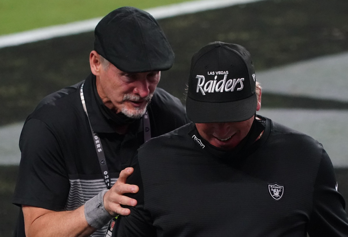 Las Vegas Raiders general manager Mike Mayock celebates with head coach Jon Gruden after defeating the New Orleans Saints in a NFL game at Allegiant Stadium.