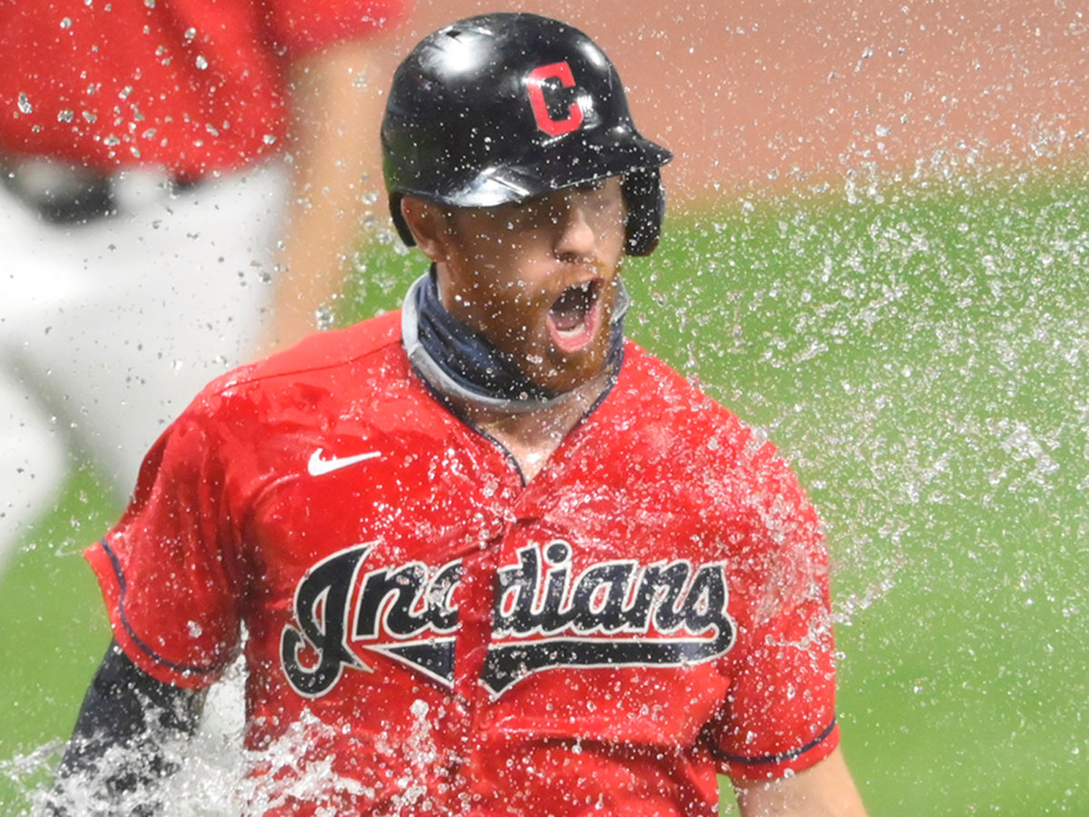 A Cleveland Indians player is splashed with water