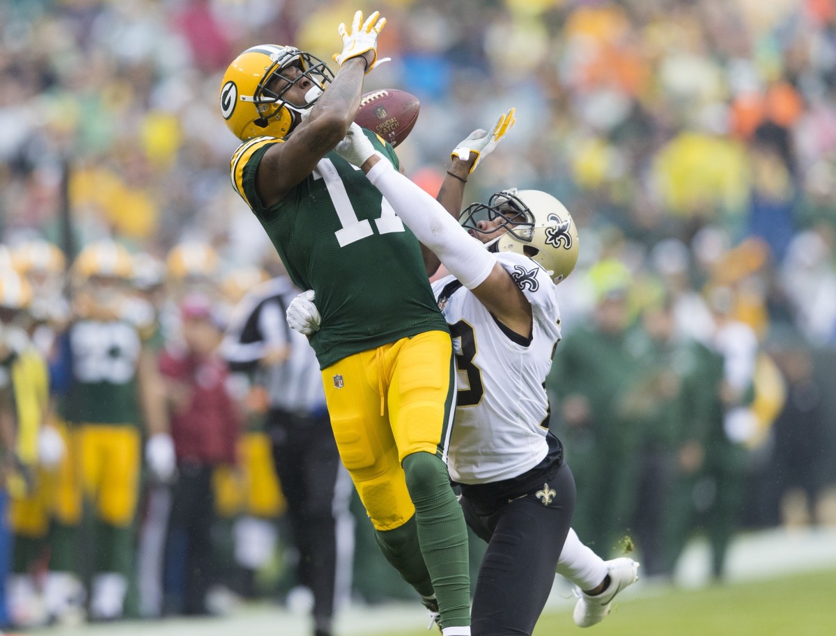 Oct 22, 2017; Green Bay, WI, USA; New Orleans Saints cornerback Marshon Lattimore (23) breaks up the pass intended for Green Bay Packers wide receiver Davante Adams (17) during the first quarter at Lambeau Field. Mandatory Credit: Jeff Hanisch-USA TODAY