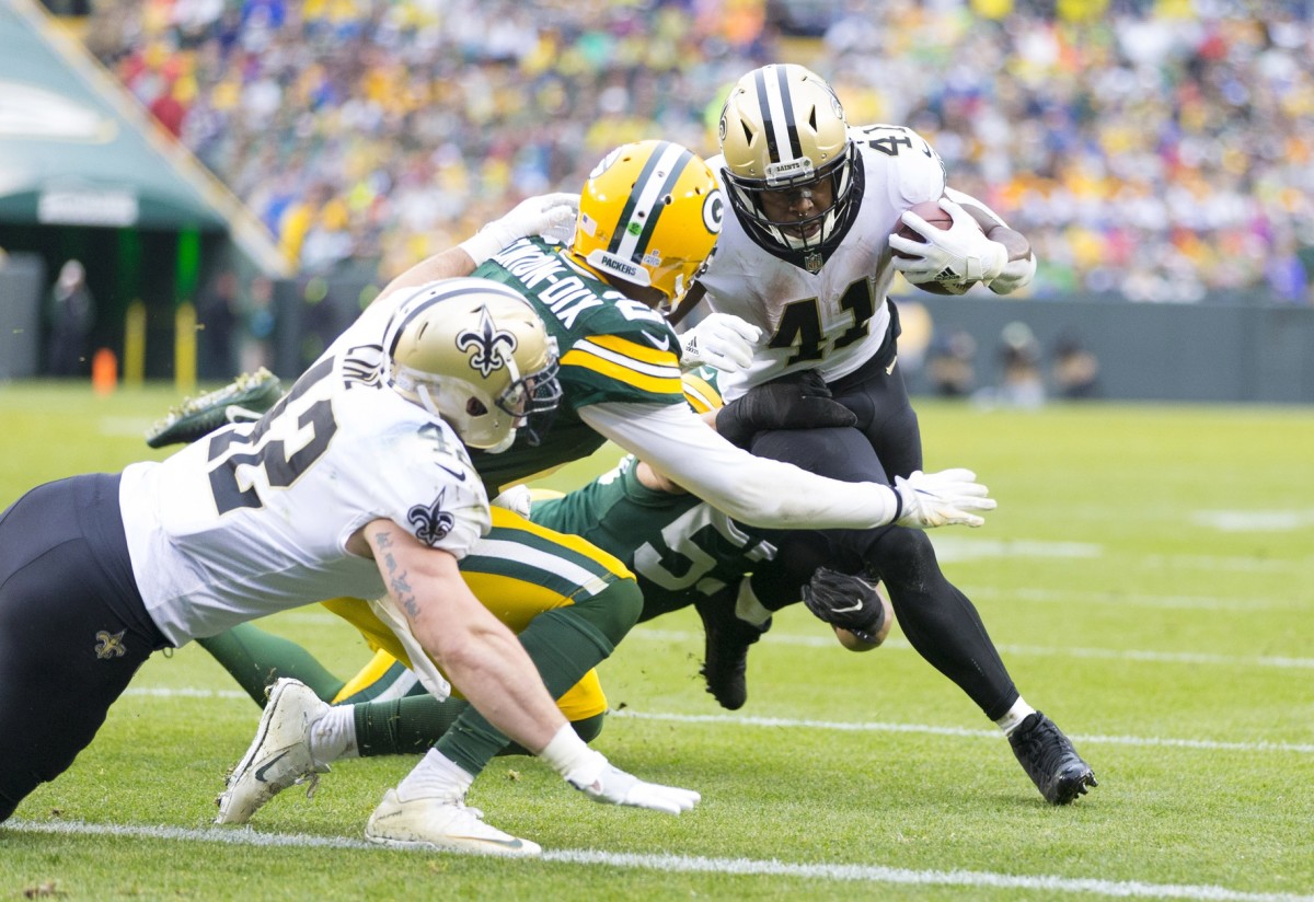 Oct 22, 2017; Green Bay, WI, USA; New Orleans Saints running back Alvin Kamara (41) carries the ball as Green Bay Packers safety Ha Ha Clinton-Dix (21) tackles during the fourth quarter at Lambeau Field. Mandatory Credit: Jeff Hanisch-USA TODAY Sports