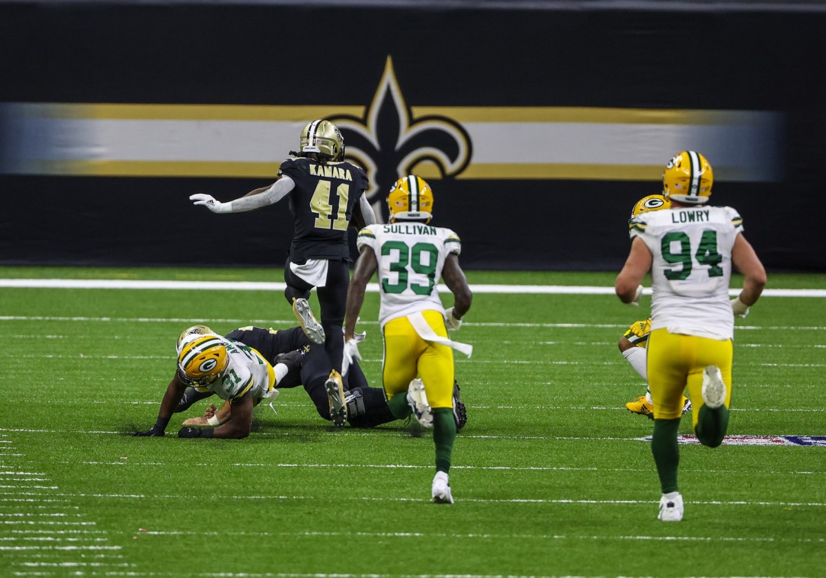 Sep 27, 2020; New Orleans, Louisiana, USA; New Orleans Saints running back Alvin Kamara (41) hurdles Green Bay Packers safety Adrian Amos (31) on a touchdown run during the second half at the Mercedes-Benz Superdome. Mandatory Credit: Derick E. Hingle-USA TODAY