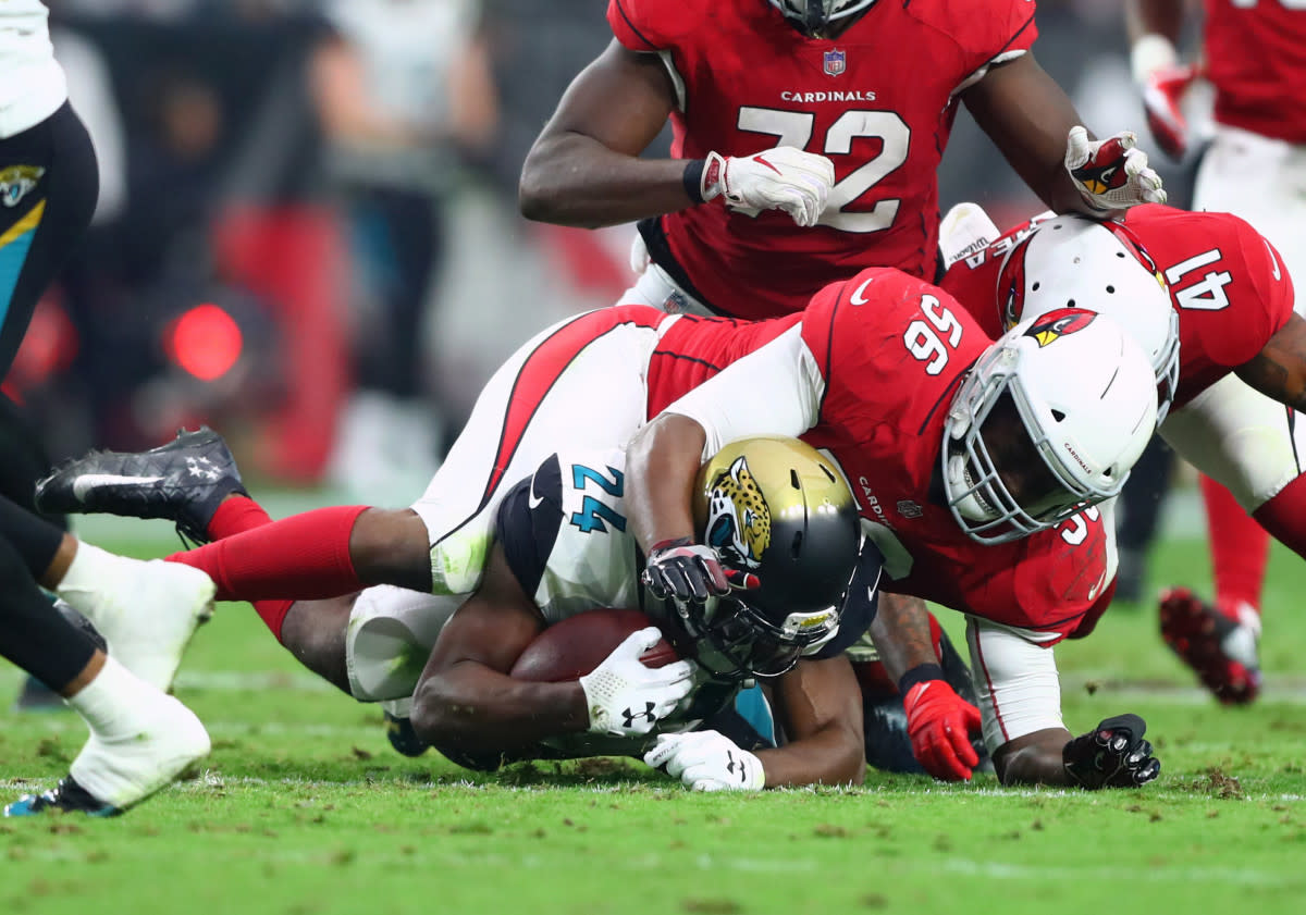 Cardinals linebacker Karlos Dansby (56) tackles Jaguars running back T.J. Yeldon (24) at University of Phoenix Stadium.