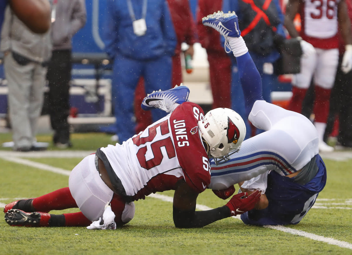 Cardinals linebacker Chandler Jones (55) tackles Giants quarterback Daniel Jones (8) during a 2019 game at MetLife Stadium.