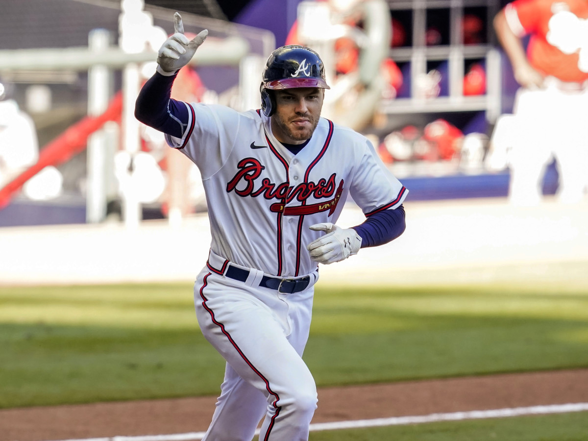 Sep 30, 2020; Cumberland, Georgia, USA; Atlanta Braves first baseman Freddie Freeman (5) reacts after singling to score the game winning run against the Cincinnati Reds during the thirteenth inning at Truist Park.