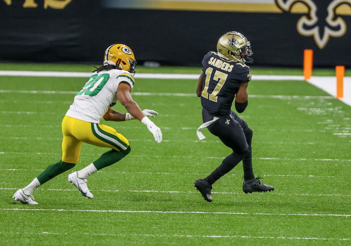 Sep 27, 2020; New Orleans, Louisiana, USA; New Orleans Saints wide receiver Emmanuel Sanders (17) catches a pass as Green Bay Packers running back Jamaal Williams (30) defends during the second half at the Mercedes-Benz Superdome. Mandatory Credit: Derick E. Hingle-USA TODAY