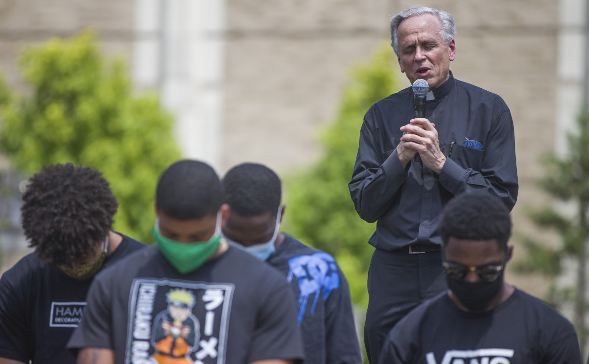 University of Notre Dame president Fr. John Jenkins leads a prayer during a celebration of Juneteenth by Notre Dame football players on Friday, June 19, 2020, at Notre Dame in South Bend, Ind.