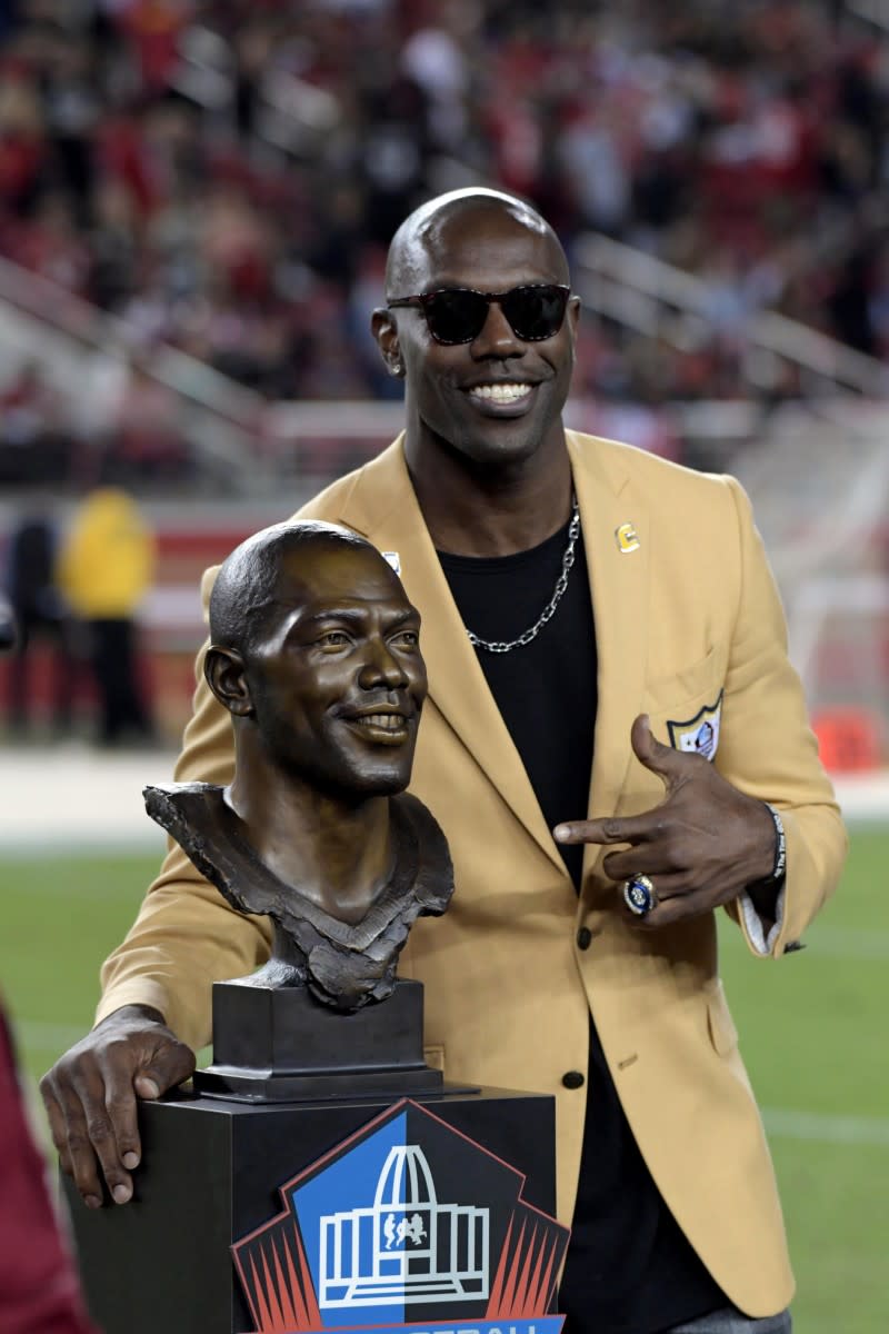 Terrell Owens, who was inducted into the Hall of Fame in 2018, smiles after being honored during a halftime presentation at Levi's Stadium.