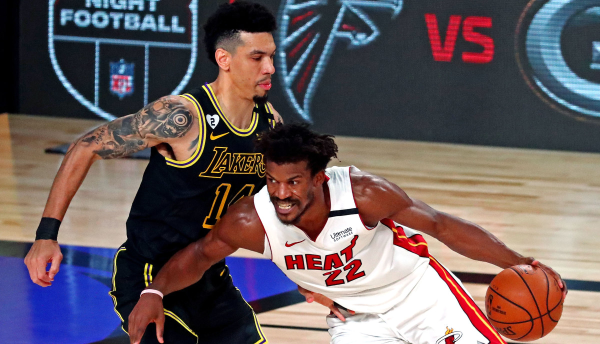 Miami Heat forward Jimmy Butler (22) drives to the basket against Los Angeles Lakers guard Danny Green (14) during the third quarter in game two of the 2020 NBA Finals at AdventHealth Arena.