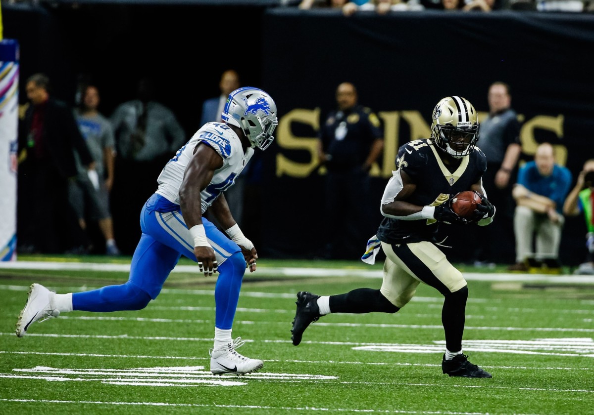 Oct 15, 2017; New Orleans, LA, USA; New Orleans Saints running back Alvin Kamara (41) runs past Detroit Lions linebacker Jarrad Davis (40) during the second half of a game at the Mercedes-Benz Superdome. The Saints defeated the Lions 52-38. Mandatory Credit: Derick E. Hingle-USA TODAY