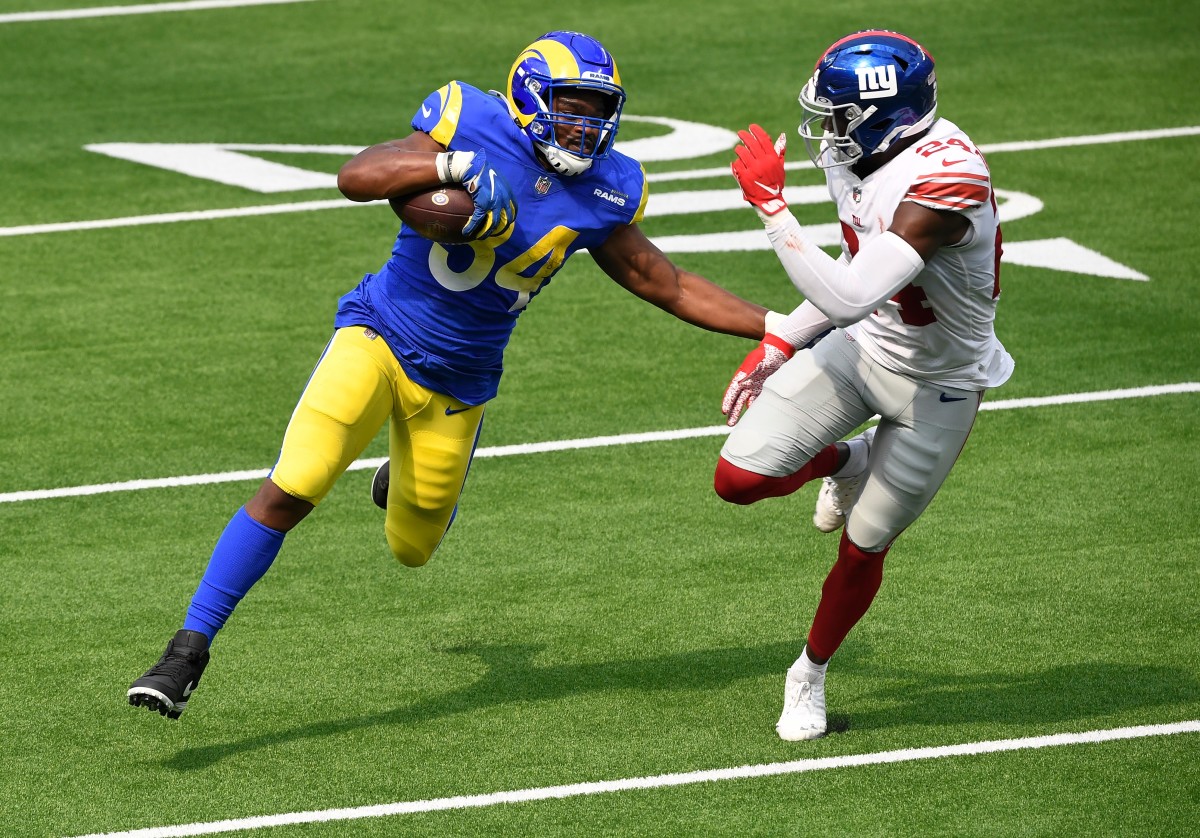 Oct 4, 2020; Inglewood, California, USA; Los Angeles Rams running back Malcolm Brown (34) tries to run past New York Giants cornerback James Bradberry (24) during the second quarter at SoFi Stadium.