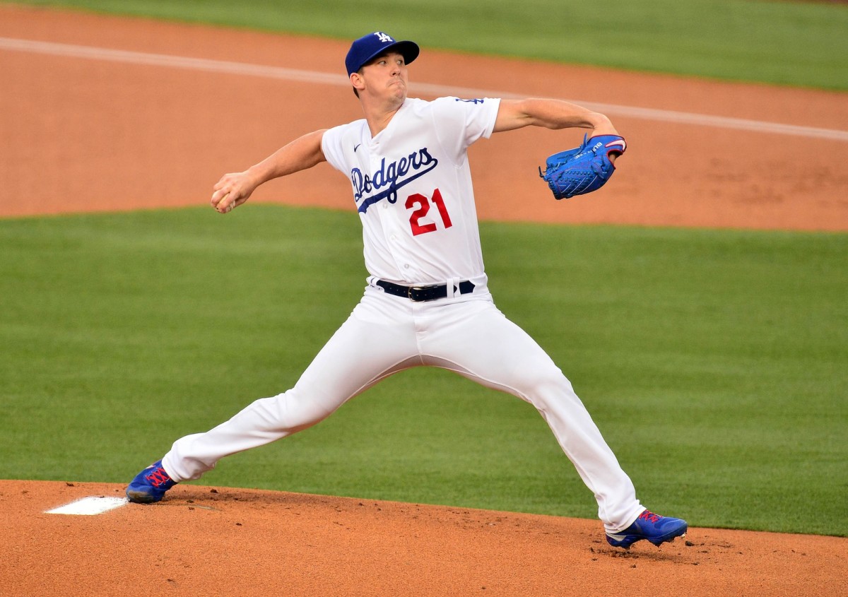 August 21, 2020; Los Angeles, California, USA; Los Angeles Dodgers starting pitcher Walker Buehler (21) throws against the Colorado Rockies during the first inning against the Colorado Rockies at Dodger Stadium. Mandatory Credit: Gary A. Vasquez-USA TODAY Sports