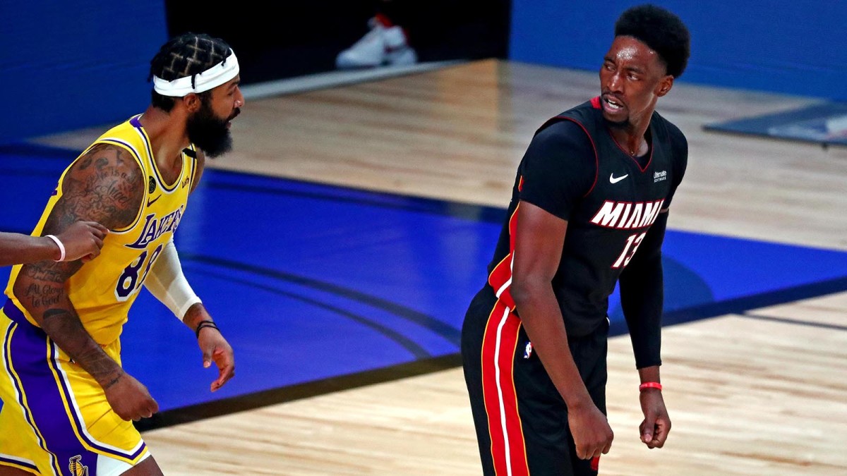 Miami Heat forward Bam Adebayo reacts after a play against Los Angeles Lakers forward Markieff Morris