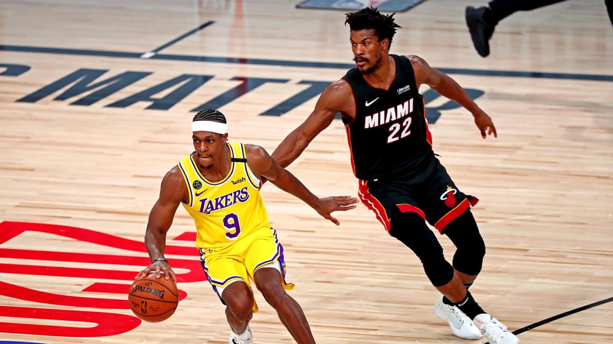 Los Angeles Lakers guard Rajon Rondo handles the ball against Miami Heat forward Jimmy Butler in the NBA Finals