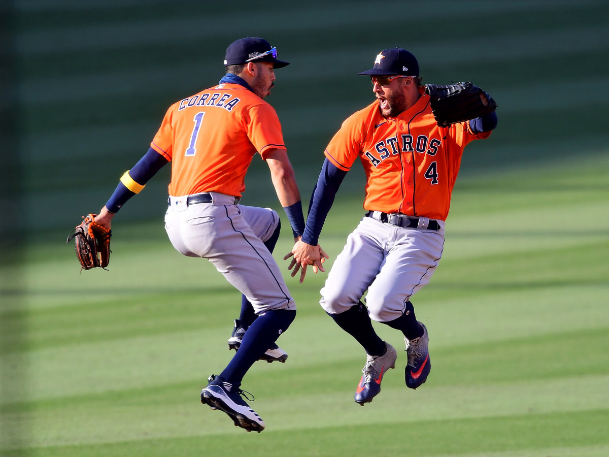 Oct 6, 2020; Los Angeles, California, USA; Houston Astros center fielder George Springer (4) celebrates with shortstop Carlos Correa (1) after the Astros defeated the Oakland Athletics during game two of the 2020 ALDS at Dodger Stadium.