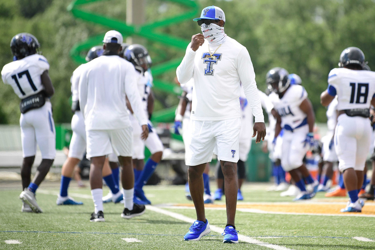 Deion Sanders in his high school coaching job